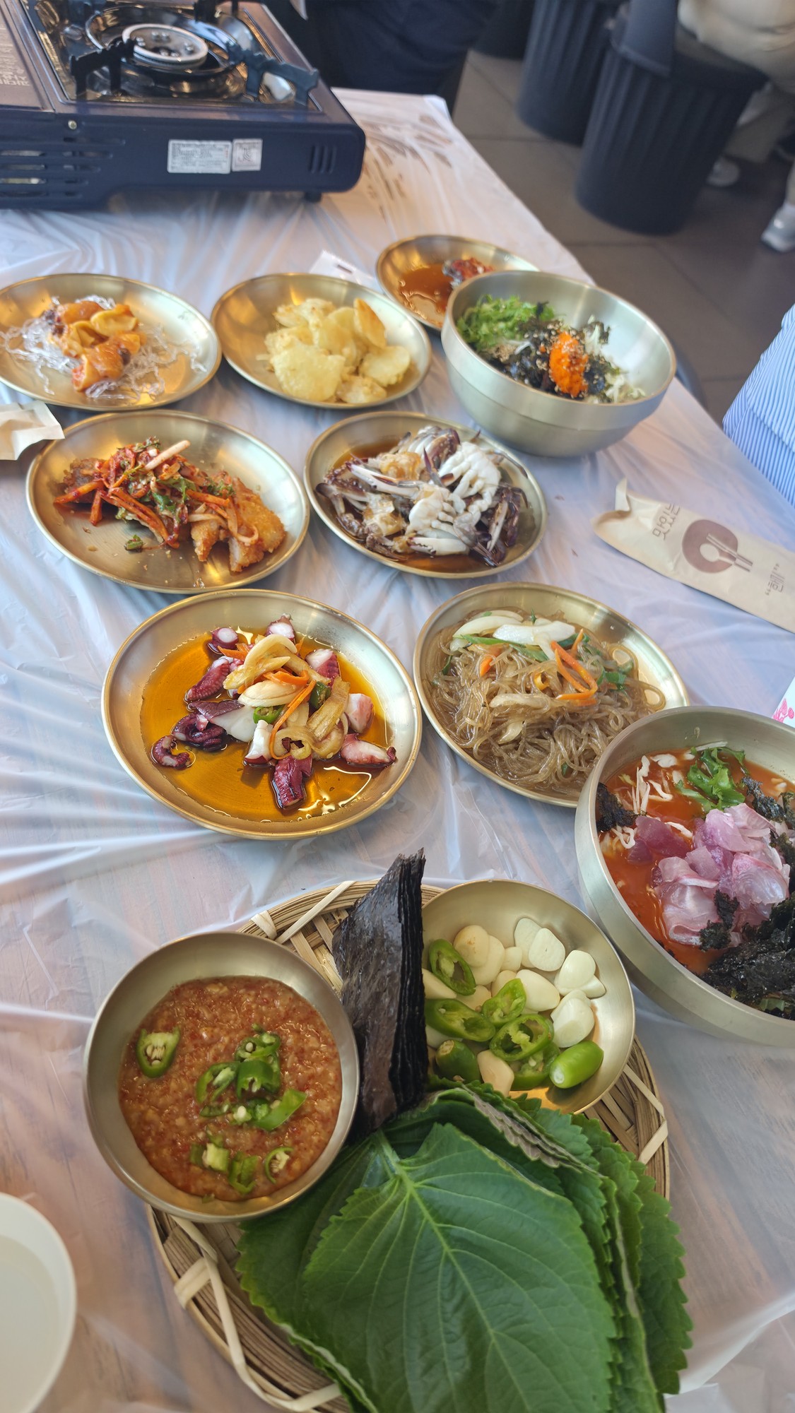 Jinmore Hoejip banchan spread mini mulhoe al-bap cockle salad Mukho