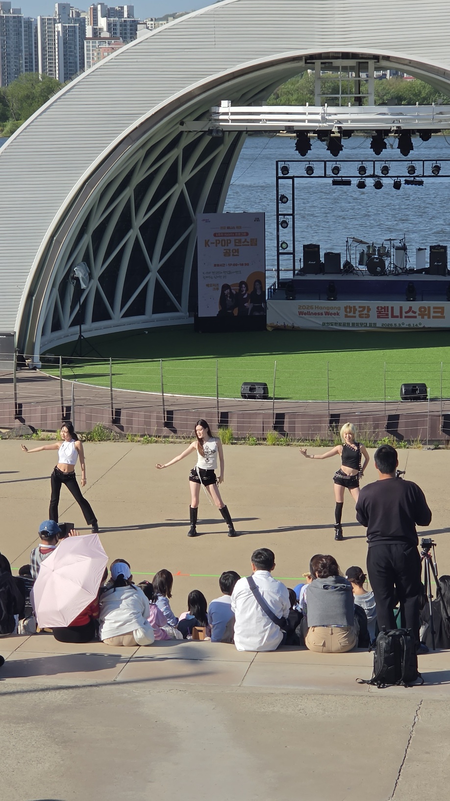 Memories Crew K-Pop dance show — Hangang Wellness Week sign and side view of the stage