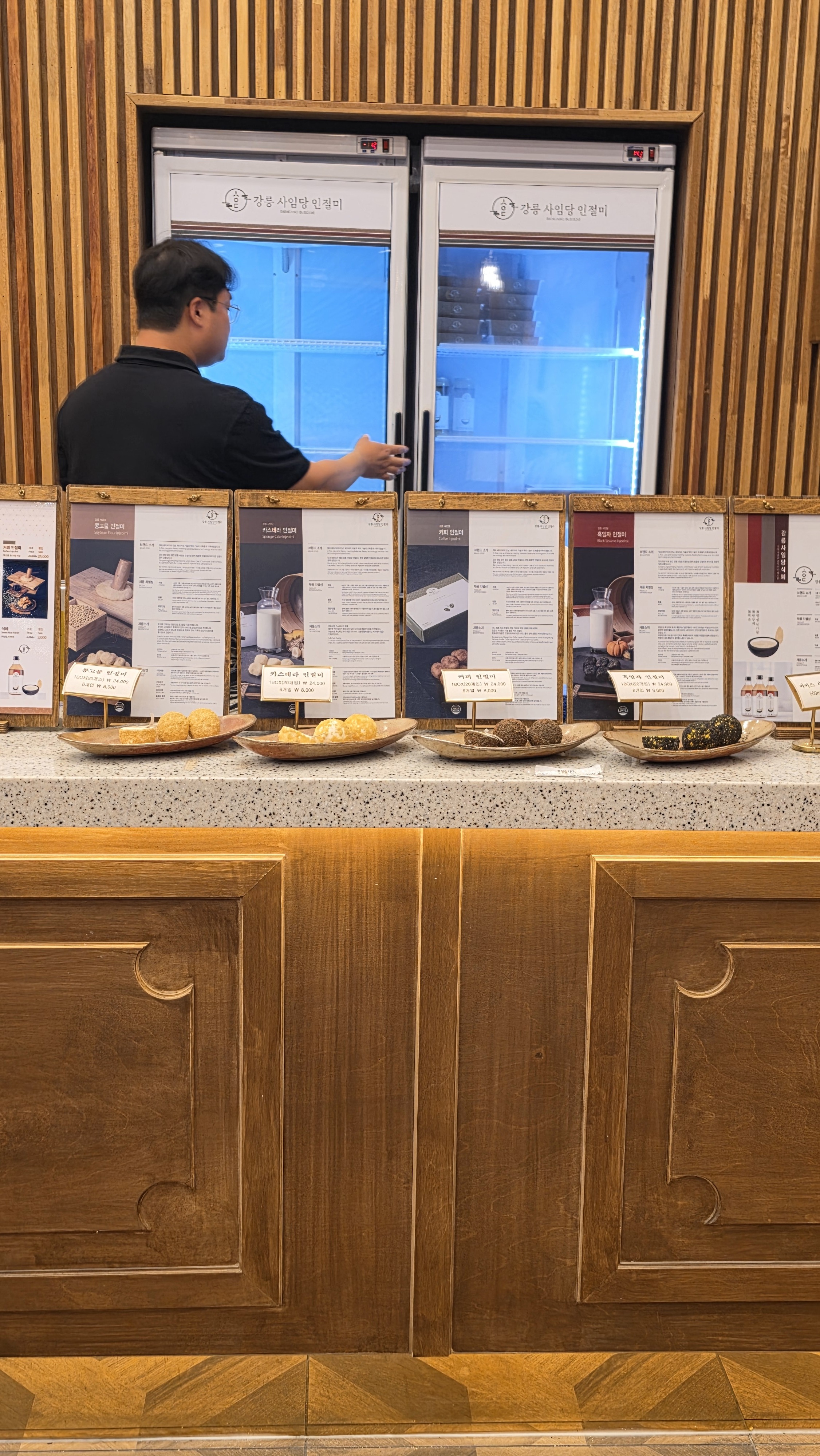 Saimdang Mochi Mukho menu display with castella, black sesame, coffee, and soybean powder mochi pricing