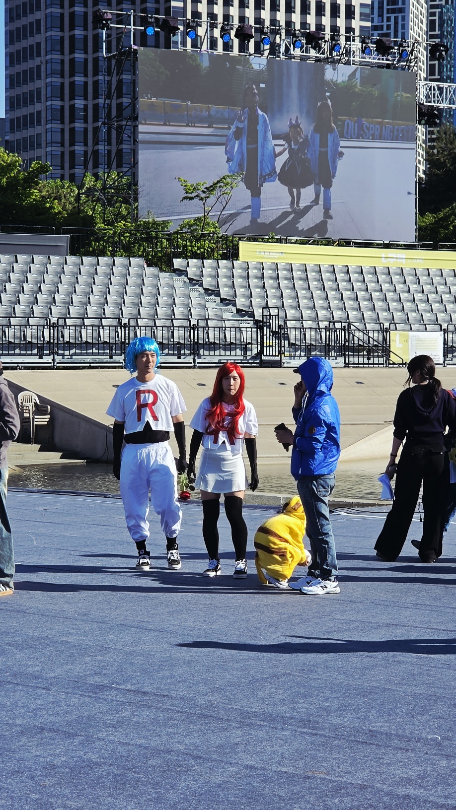 Seoul Spring Festival cosplay zone — variety of character costumes at the fountain plaza